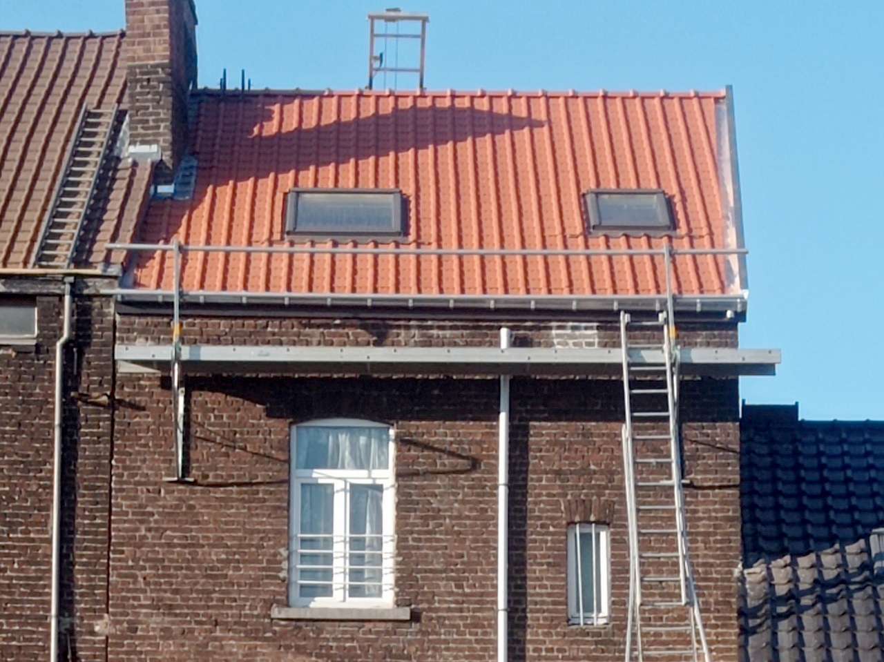 Travaux de rénovation d'une toiture en pente